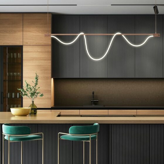 a modern kitchen with a bar and stools