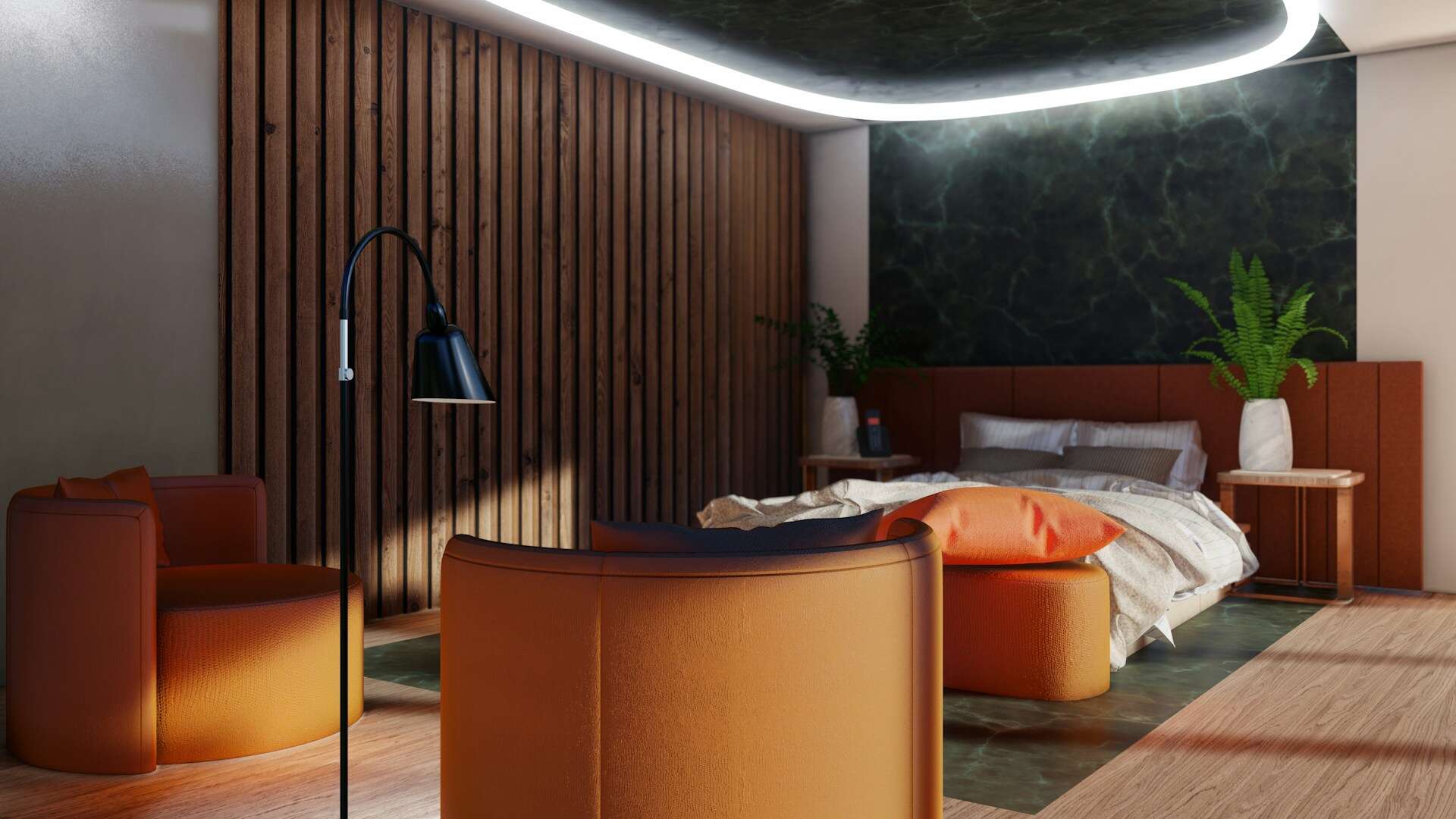 a room with orange couches and a black lamp