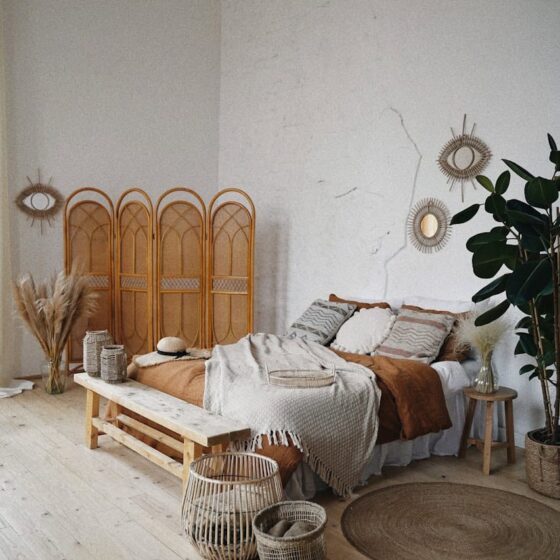 brown wooden door near brown woven armchair